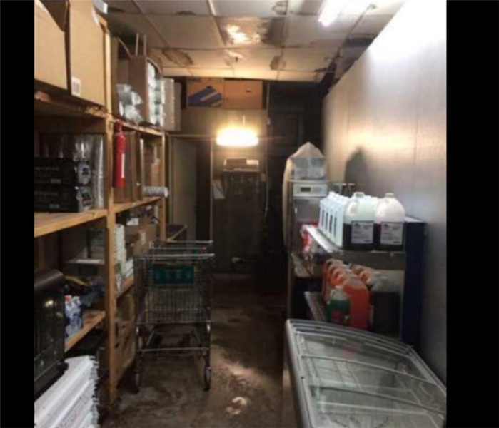 Water damage to concrete floor commercial business 