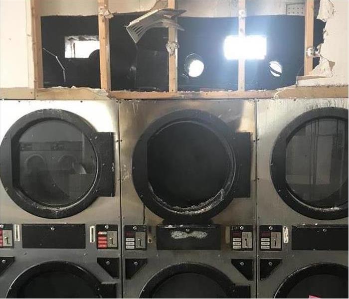 soot and fire damage at laundry mat facility