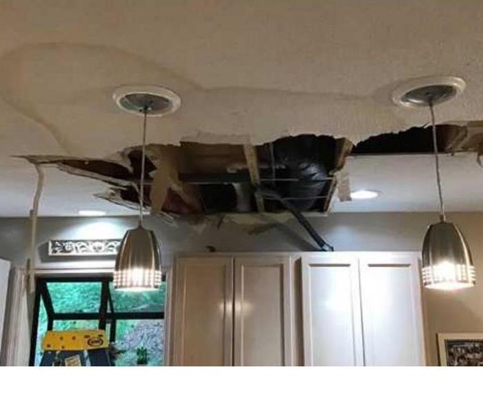 open ceiling in kitchen from water loss 