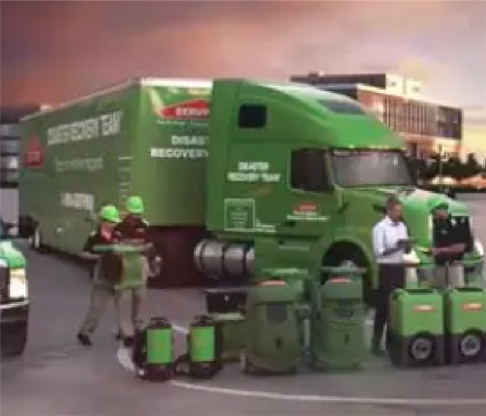 Green SERVPRO Trucks and technicians responding to storm 